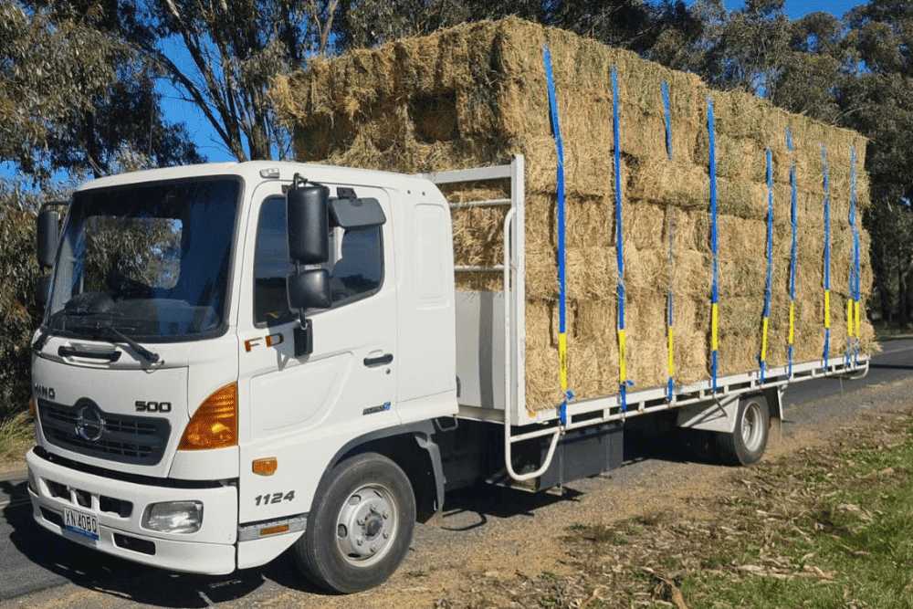 Hay deliveries A truck loaded with large hay bales for delivery to farms around Yass, Bowning, Murrumbateman, and Canberra